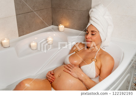 Expectant Mother Enjoying a Relaxing Bath Expectant Mother Enjoying a Relaxing Bath 122192193