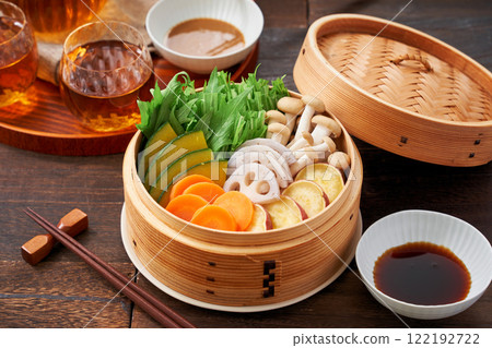 Colorful vegetables steamed in a bamboo steamer, a healthy Japanese dish Colorful vegetables steamed in a bamboo steamer, a healthy Japanese dish 122192722