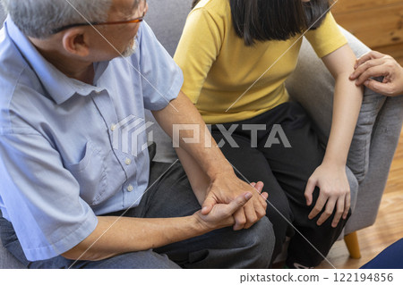 Parents telling the psychologist about family or child problems. Depressed girl and her parent or grandpa having session with psychiatrist in clinic. Parents telling the psychologist about family or child problems. Depressed girl and her parent or grandpa having session with psychiatrist in clinic. 122194856