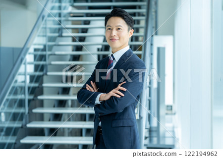 Business people standing in an office corridor Business people standing in an office corridor 122194962