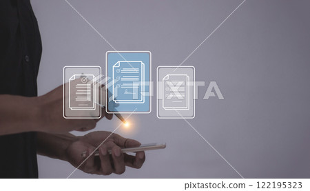 Young man with smartphone mobile hand using a pen touching to sign a Online Business Contract Young man with smartphone mobile hand using a pen touching to sign a Online Business Contract 122195323