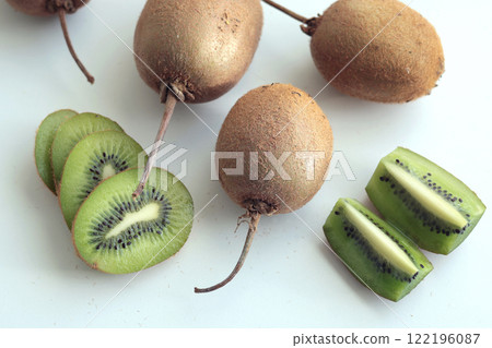 Group of kiwi with tails from home garden on white background. Eco-friendly pure natural product.  122196087