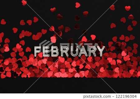 Text of white metallic letters February in English on the background with red heart confetti Text of white metallic letters February in English on the background with red heart confetti 122196304