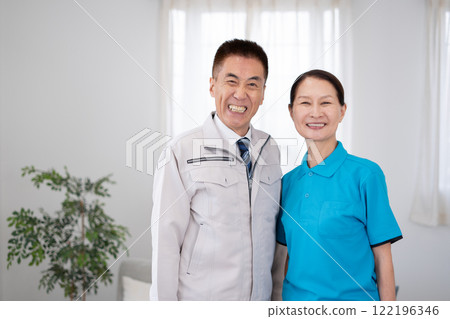 Senior male and female housekeepers 122196346