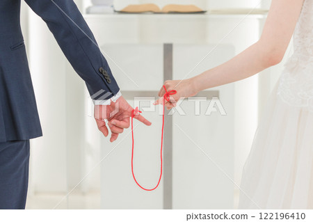 Bride and groom tied with a red thread at the wedding ceremony (bridal wedding) Bride and groom tied with a red thread at the wedding ceremony (bridal wedding) Bride and groom tied with a red thread at the wedding ceremony (bridal wedding) Bride and groom tied with a red thread at the wedding ceremony (bridal wedding) 122196410