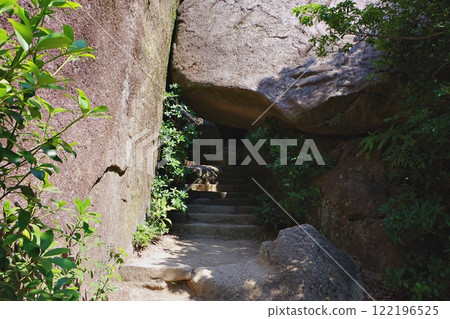 Front view of a natural rock tunnel 122196525