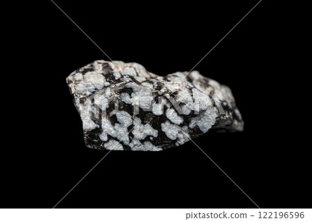 Closeup snowflake obsidian on dark background 122196596