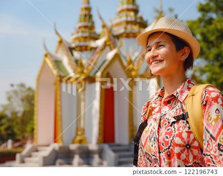 Travel to Ayutthaya, Thailand. Young female tourist explores modern Buddhist temples, surrounded by vibrant architecture and cultural symbols, capturing essence of spirituality and Thai heritage. Travel to Ayutthaya, Thailand. Young female tourist explores modern Buddhist temples, surrounded by vibrant architecture and cultural symbols, capturing essence of spirituality and Thai heritage. 122196743