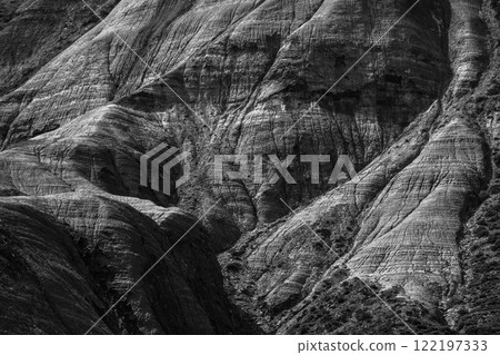 Detailed black and white image of textured rock formations 122197333
