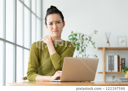 Young woman with stiff neck 122197598