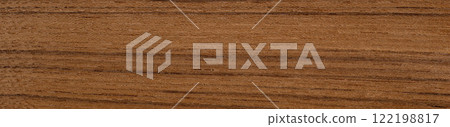 Teak veneer with smooth grain and warm cinnamon wood tones 122198817