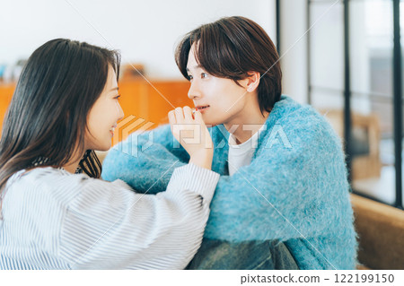 A woman applying lipstick to her boyfriend 122199150