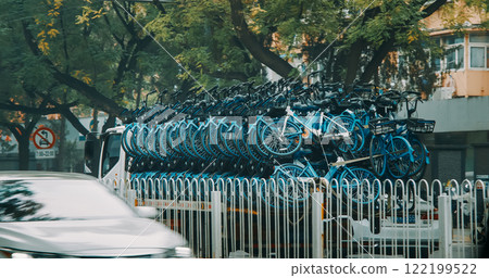 Transportation Of New Bicycles. Truck Carries Many Bicycles Around City. Green Clean Energy Concept. Shared Bicycles. Blue Modern Bicycles. Ecological Transport. Pollution Problem. Environmental Care 122199522