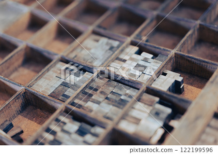 Closeup of vintage wooden compartments with printing blocks Closeup of vintage wooden compartments with printing blocks 122199596