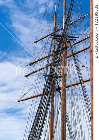 Tall ship rigging against blue sky Tall ship rigging against blue sky 122199632