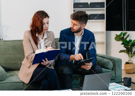 Project manager working and update tasks with milestones progress planning and professional investor working new start up project in the office. Project manager working and update tasks with milestones progress planning and professional investor working new start up project in the office. 122200100