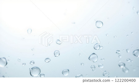 Water droplets on clear glass surface with light blue background, creating fresh and clean look. Perfect for themes of purity, hydration, and nature. Ideal for backgrounds, advertisement 122200400