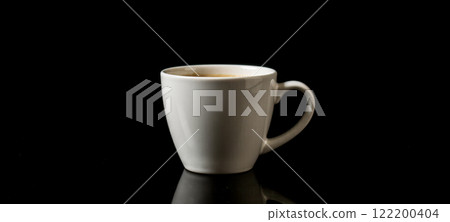 White ceramic coffee cup filled with hot beverage on black background. Simple and elegant design. coffee shops, cafes, restaurants. Reflective surface adds depth and contrast White ceramic coffee cup filled with hot beverage on black background. Simple and elegant design. coffee shops, cafes, restaurants. Reflective surface adds depth and contrast 122200404