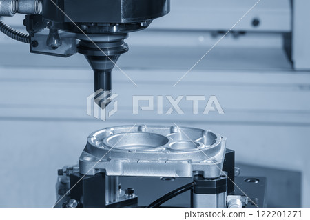 The CNC milling machine chamfer cutting aluminum part by chamfer tool in the light blue scene. The CNC milling machine chamfer cutting aluminum part by chamfer tool in the light blue scene. 122201271