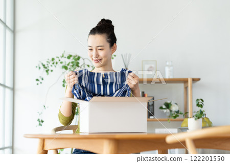 Young woman shopping online Young woman shopping online 122201550