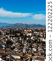 Granada city and towering mountains 122202225