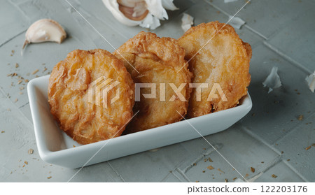 rectangular plate with some spanish shrimp cakes 122203176