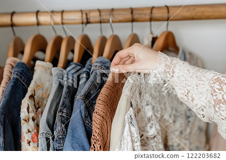 Thrifted vintage clothes: Curated rack of denim and lace 122203682
