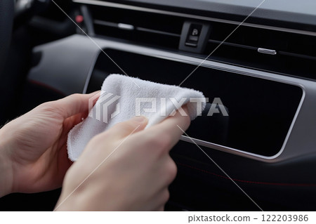 Microfiber cloth wiping car dashboard 122203986