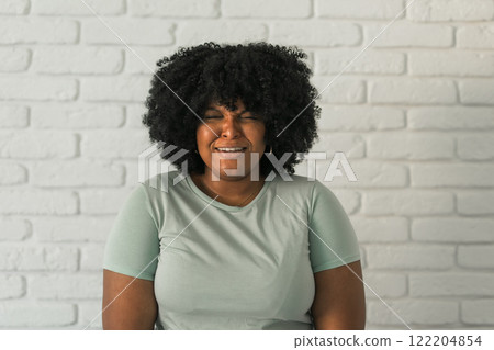 Depression, stress and woman crying in studio with fear, mistake or mental health crisis on white background. Anxiety, broken heart or sad model frustrated by conflict trauma, disaster for self doubt Depression, stress and woman crying in studio with fear, mistake or mental health crisis on white background. Anxiety, broken heart or sad model frustrated by conflict trauma, disaster for self doubt 122204854