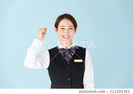 Woman in uniform giving a fist pump Woman in uniform giving a fist pump 122205361