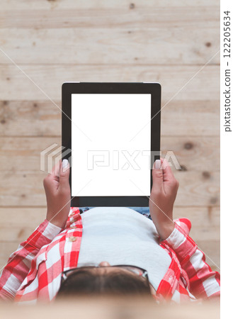Woman using her tablet with blank of screen 122205634