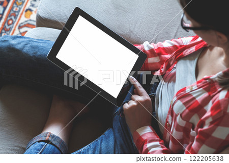Woman using her tablet with blank of screen 122205638