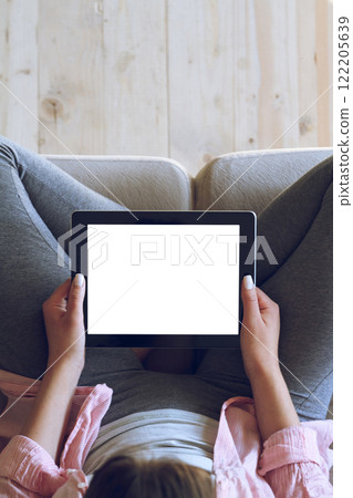 Woman using her tablet with blank of screen Woman using her tablet with blank of screen 122205639