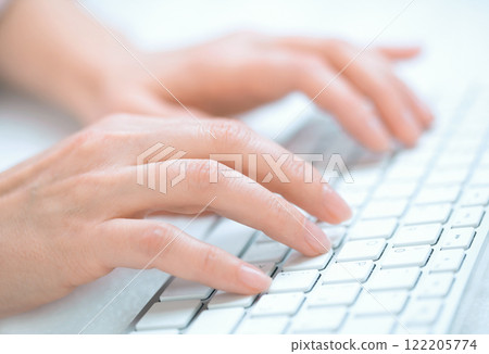 Woman's hands typing Woman's hands typing 122205774