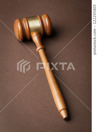 Wooden gavel on brown background Wooden gavel on brown background 122205805