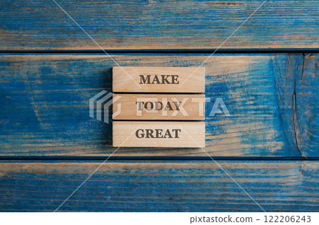 Make today great sign written on three stacked wooden pegs Make today great sign written on three stacked wooden pegs 122206243