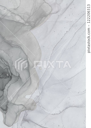 Abstract alcohol ink artwork displaying muted tones on a textured surface 122206313