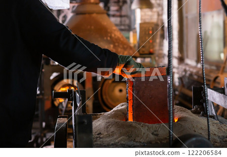 Ferrous metal billet is melted in an induction furnace closeup 122206584