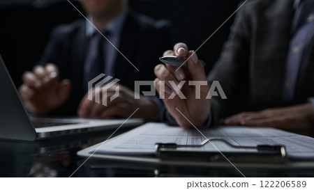 Close-up of a hand using a writing pen with a paperwork questionnaire or survey, Close-up of a hand using a writing pen with a paperwork questionnaire or survey, 122206589