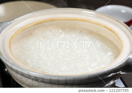 White rice porridge cooked in a clay pot White rice porridge cooked in a clay pot 122207705