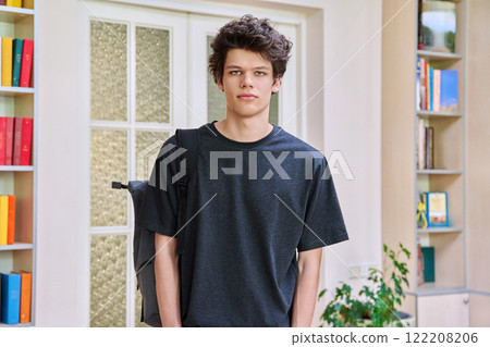 Portrait of college student guy inside classroom of educational building 122208206