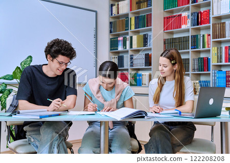 Group of high school students studying in library classroom 122208208