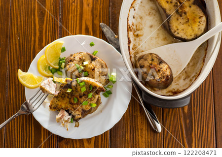 Baked fish with lemon and herbs, top view Baked fish with lemon and herbs, top view 122208471