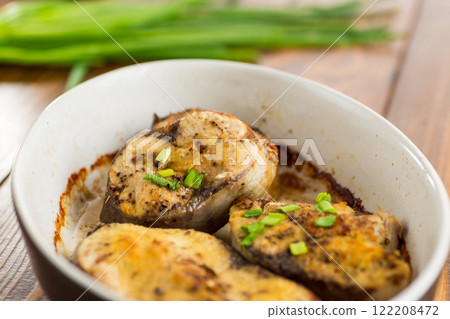 Baked fish with lemon and herbs Baked fish with lemon and herbs 122208472