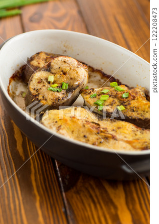Baked fish with lemon and herbs Baked fish with lemon and herbs 122208473