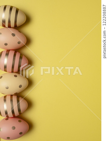 Easter eggs on yellow background Easter eggs on yellow background 122208887