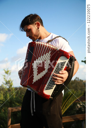 Dynamic Accordionist in Nature Embrace Dynamic Accordionist in Nature Embrace 122210075