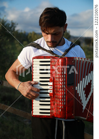 Dynamic Accordionist in Nature Embrace Dynamic Accordionist in Nature Embrace 122210076