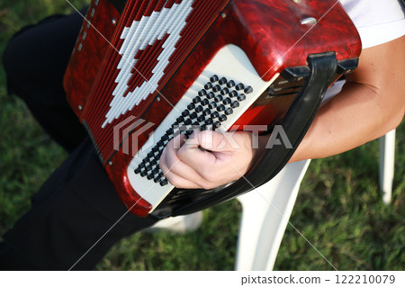 Hands Of A Professional Player On The Accordion Buttons Hands Of A Professional Player On The Accordion Buttons 122210079