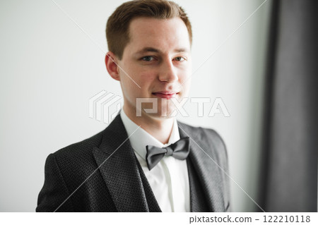 Beautiful man, groom posing and preparing for wedding 122210118